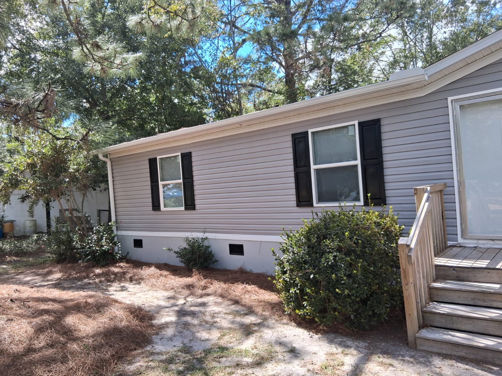 Residential gutter installation near a porch